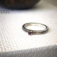 Load image into Gallery viewer, Solid sterling silver and gold ring set with a deep red garnet. Size Q1/2