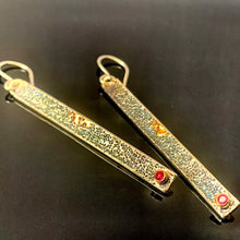 Load image into Gallery viewer, Solid sterling silver and gold earrings set with deep pink Rubies.