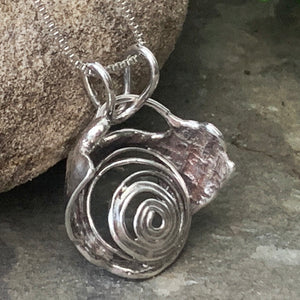"Galaxy", hollow form, reversible sterling silver pendant.