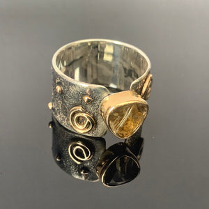 Solid sterling silver and gold ring set with incredible gold rutile quartz. Size T