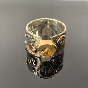 Solid sterling silver and gold ring set with incredible gold rutile quartz. Size T