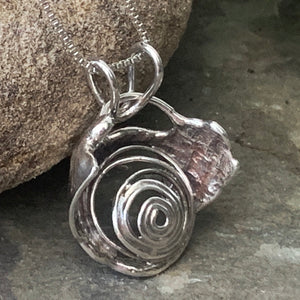 "Galaxy", hollow form, reversible sterling silver pendant.