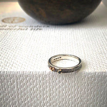 Load image into Gallery viewer, Solid sterling silver and gold ring set with a sparkling black spinel. Size O 1/2
