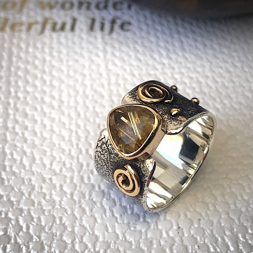 Solid sterling silver and gold ring set with incredible gold rutile quartz. Size T