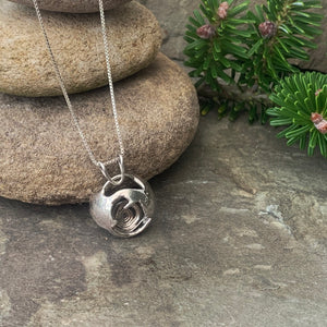 "Galaxy", hollow form, reversible sterling silver pendant.