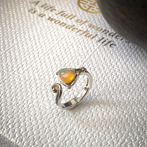 Solid sterling silver and gold ring set with incredible, ethically sourced,Ethiopian opal. Size R